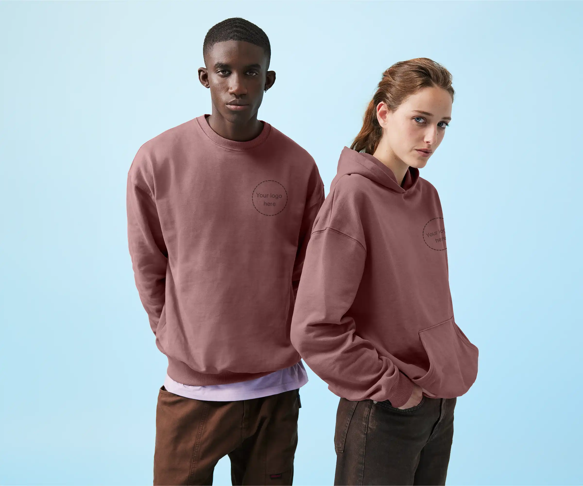 Two people wearing custom branded crewneck and hoodie ready for your logo