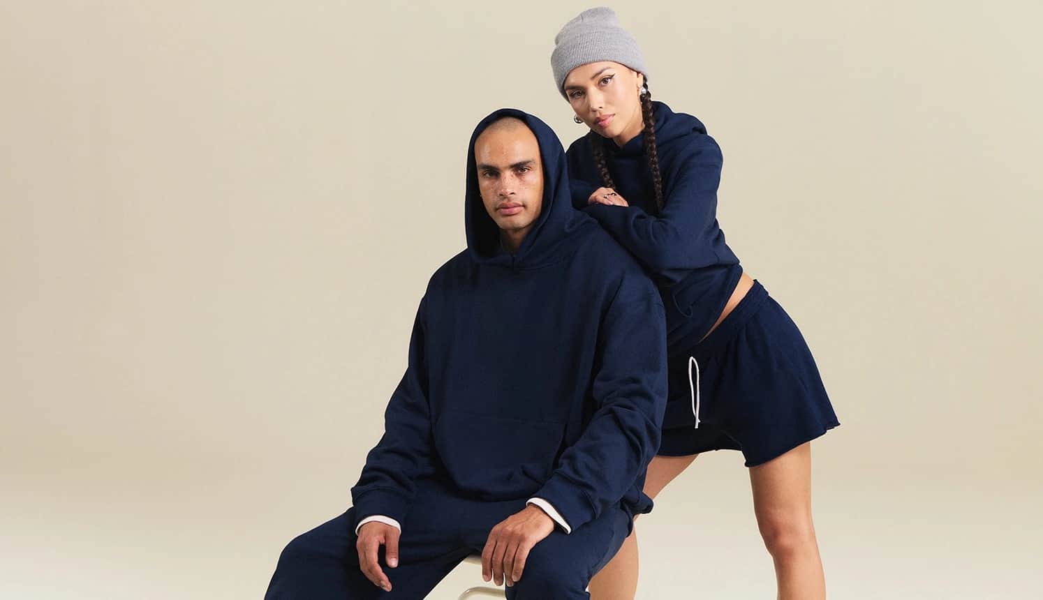 Team members wearing branded hoodies and tees